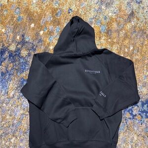 Fear of God Essentials Black Hoodie reflective